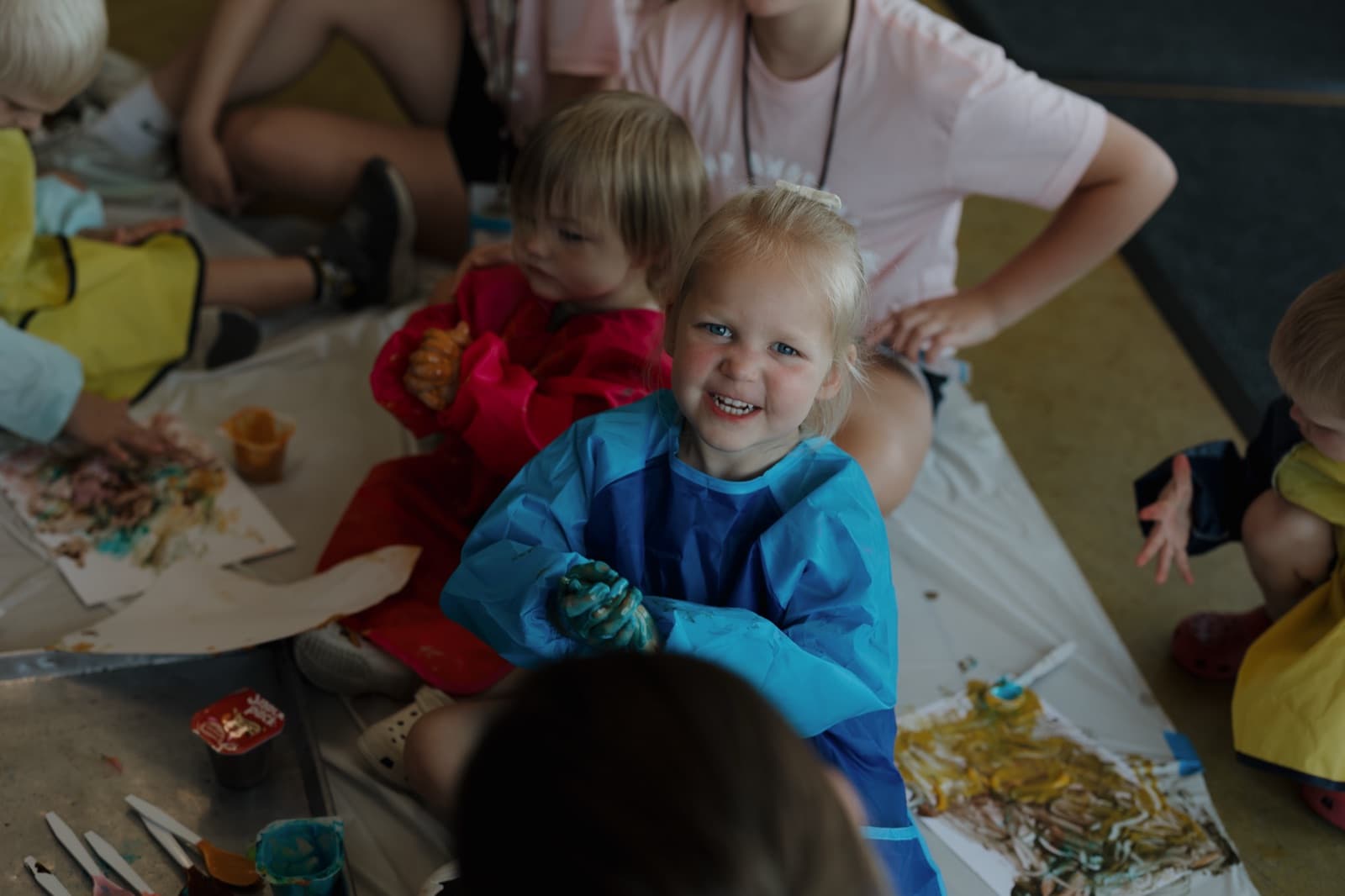 Toddlers painting together in Kids’ Ministry.